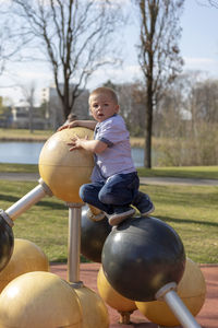 Portrait of cute boy playing in playground