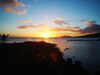 Scenic view of sea against sky at sunset