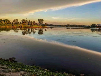 Scenic view of lake against sky during sunset