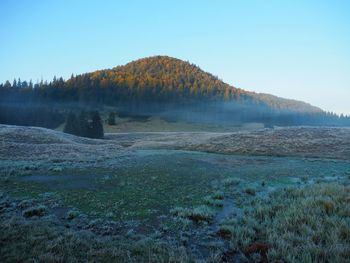 View of landscape with mountain in the background