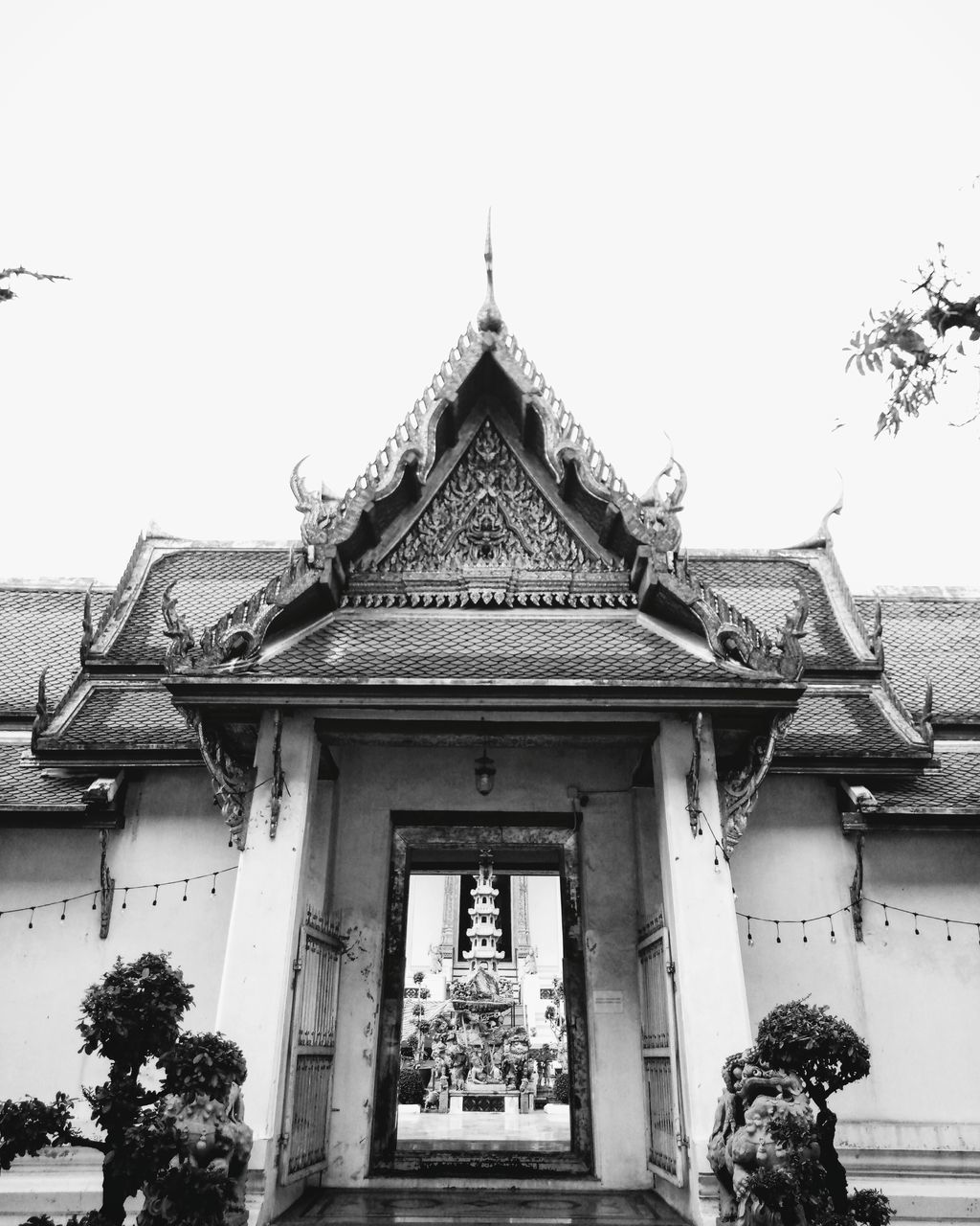 built structure, architecture, building exterior, building, sky, clear sky, day, low angle view, belief, tree, place of worship, religion, no people, nature, roof, history, the past, plant, spirituality, outdoors, ornate