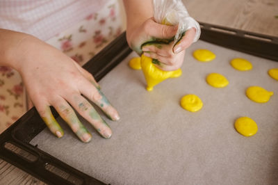 Close-up of woman baking cookies