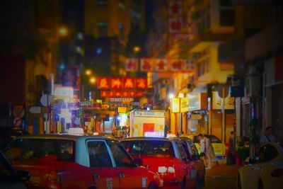 Illuminated city street at night