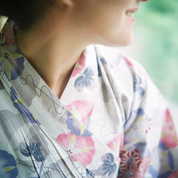 Midsection close-up of woman looking away