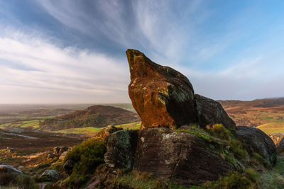 Rock formation on mountain against sky