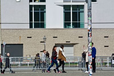 Men on sidewalk in city