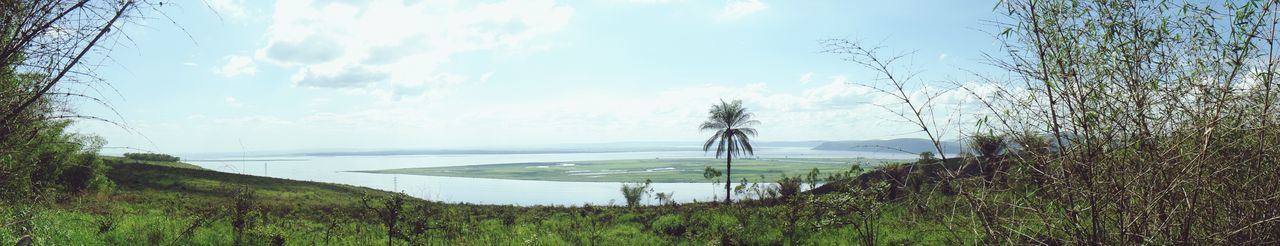 Panoramic view of field against sky