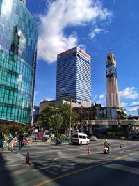 City street and modern buildings against sky