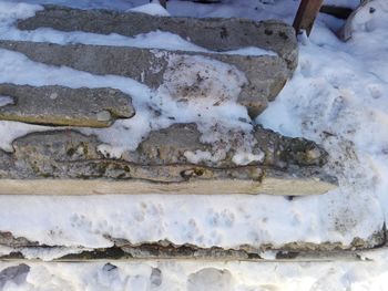 High angle view of snow covered rusty metal