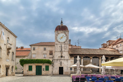 Loggia and clock tower on central square in trogir, croatia