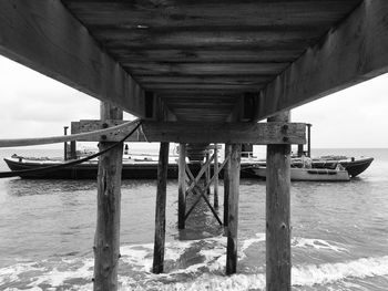 Pier over sea against sky