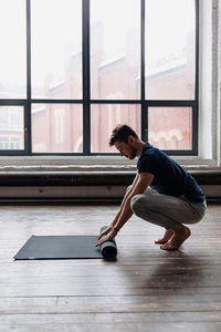 A man engaged in yoga and meditation, performing asanas