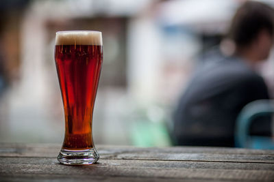 Close-up of beer glass on table