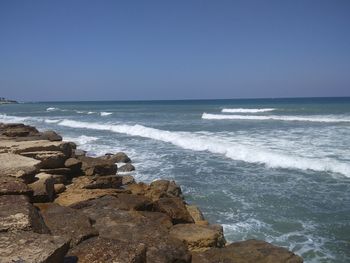 Scenic view of sea against clear sky