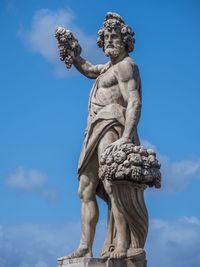 Low angle view of statue against sky