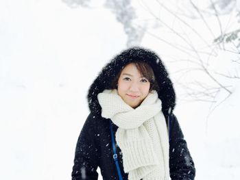 Portrait of young woman in snow