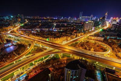 High angle view of illuminated cityscape at night