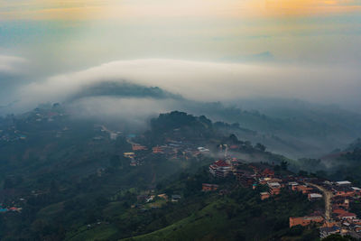 Beautiful landscape of mountain layer and winter fog at mae salong nai, chiangrai, thailand