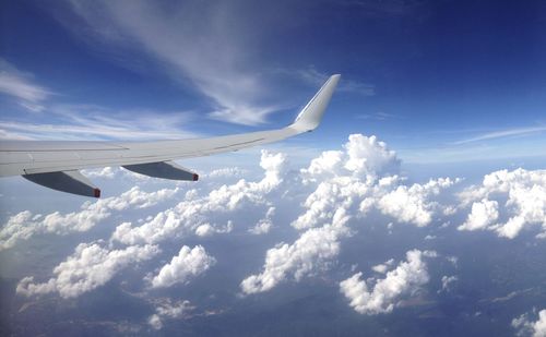 Low angle view of airplane flying in sky