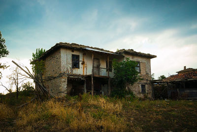 Abandoned house against sky