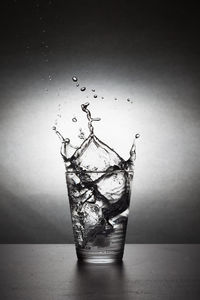 Close-up of water splashing on glass