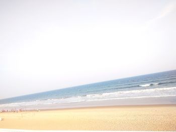 Scenic view of beach against clear sky