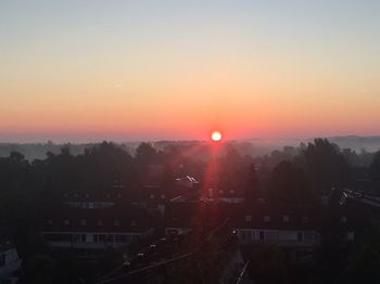 High angle view of city during sunset