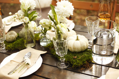 Flowers in glass vase on table