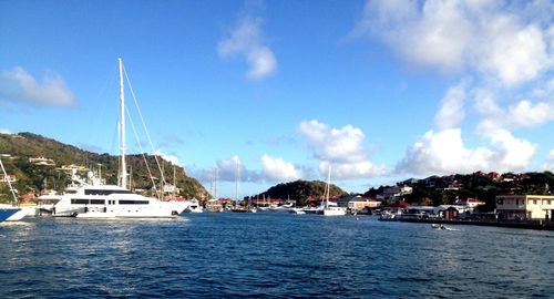 Boats moored at harbor