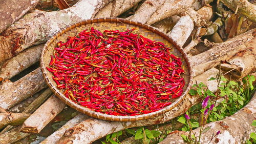 High angle view of red chili peppers in basket