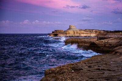 Scenic view of sea against cloudy sky