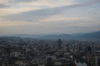 High angle view of buildings against sky in city