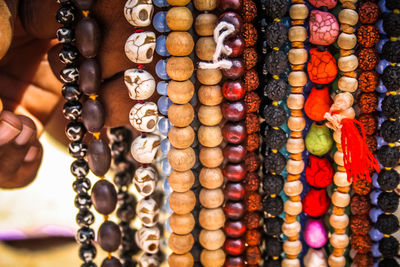 Close-up of multi colored jewelry for sale in market