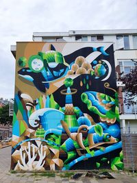 Graffiti on wall against sky