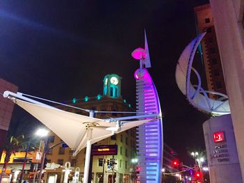 Low angle view of illuminated building at night