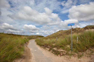 Road amidst landscape against sky