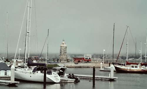 Boats moored at harbor