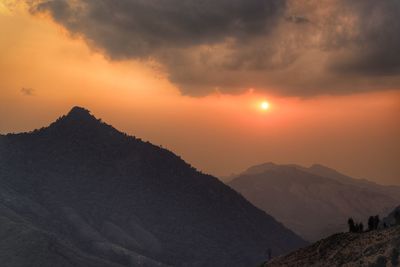 Scenic view of mountains against sky during sunset