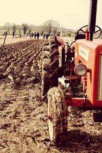 Group of people working on field