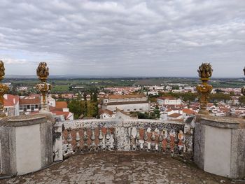 High angle view of townscape against cloudy sky