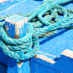 Close-up of rope tied to wooden post