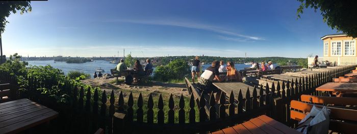 Group of people in city against sky