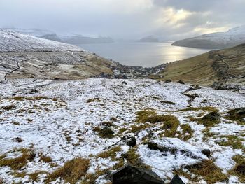 Scenic view of sea against sky during winter