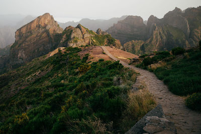 Scenic view of landscape and mountains against sky