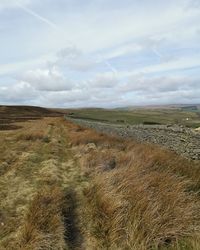 Scenic view of land against sky