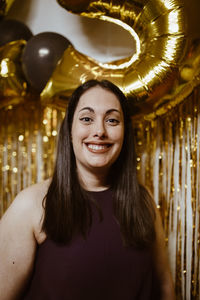 Portrait of smiling young woman at home