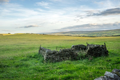 Stone structure on rolling landscape