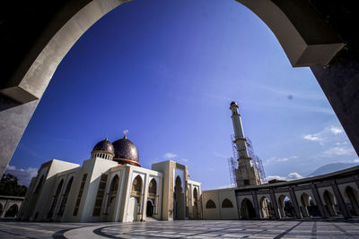 Low angle view of historical building against blue sky