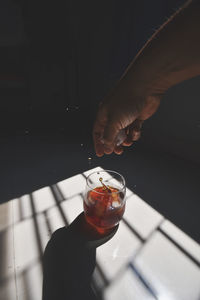 Close-up of hand holding drink