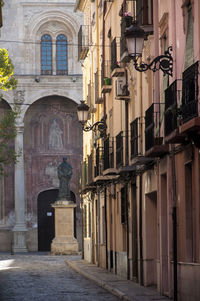 View of statues on street in city